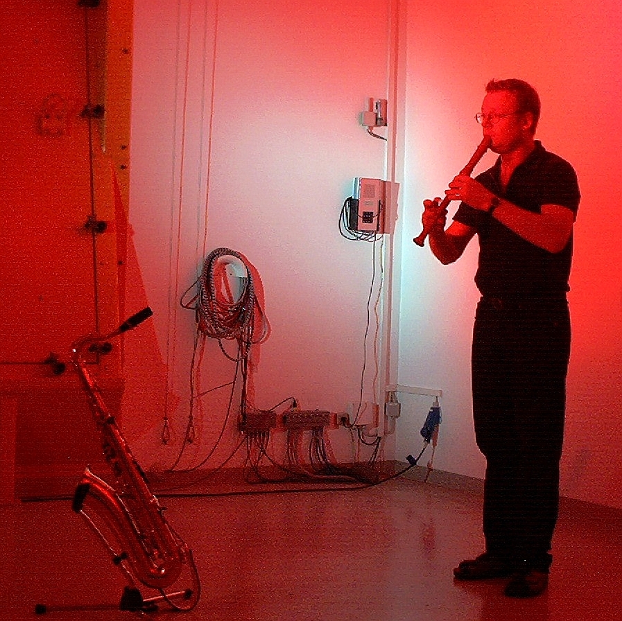 Michael Haverkamp playing improvised music with recoders and saxophone in a reverberation chamber at Ford development center Cologne, 2014