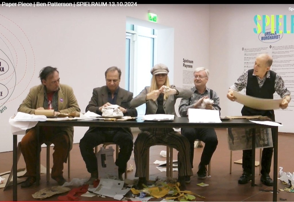 Performing Paper Piece by Ben Patterson (1960) at Museum Ludwig, Cologne, 13.10.2024, initiated by Peter Wolf, as a contribution to the exhibition "FLUXUS und darüber hinaus."
